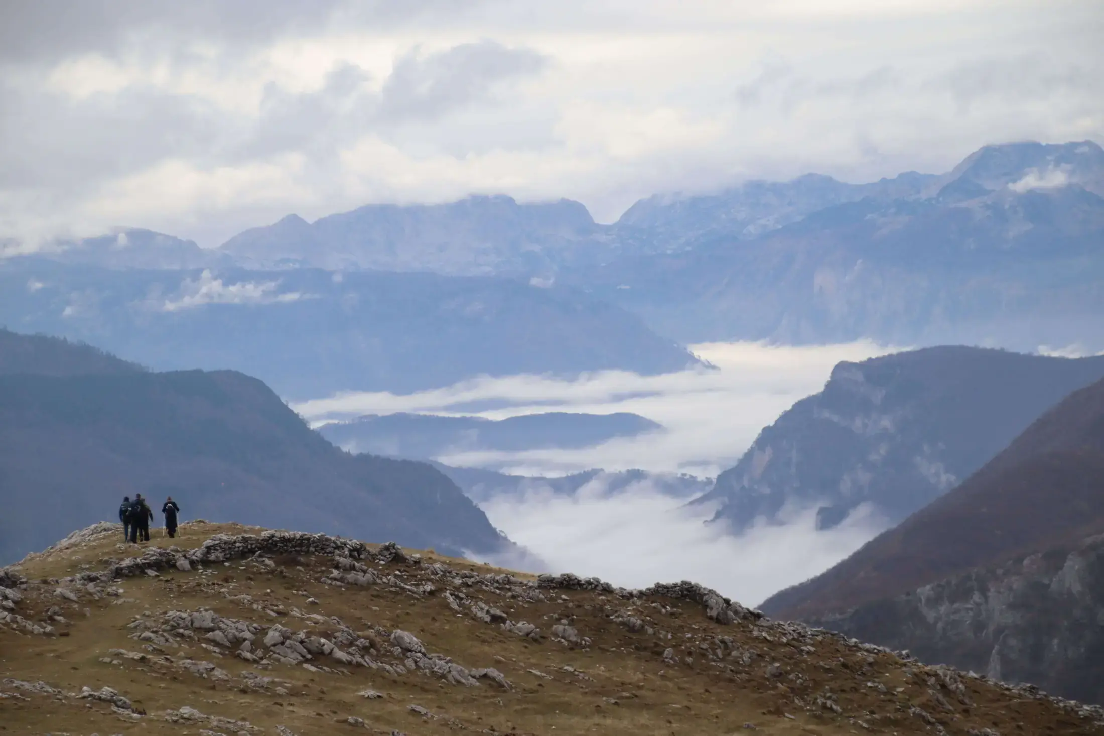 Hikers crossing the mountains near Lukomir